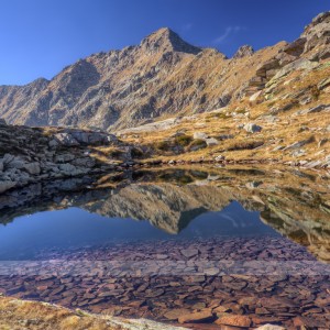 Mont Mars reflected in the clear water of the Laghetto di Monterosso (Riserva Naturale di Mont Mars - Valle d'Aosta, Italy)