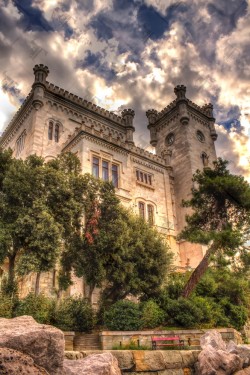Miramare castle and its West tower overlooking the natural bay of Grignano